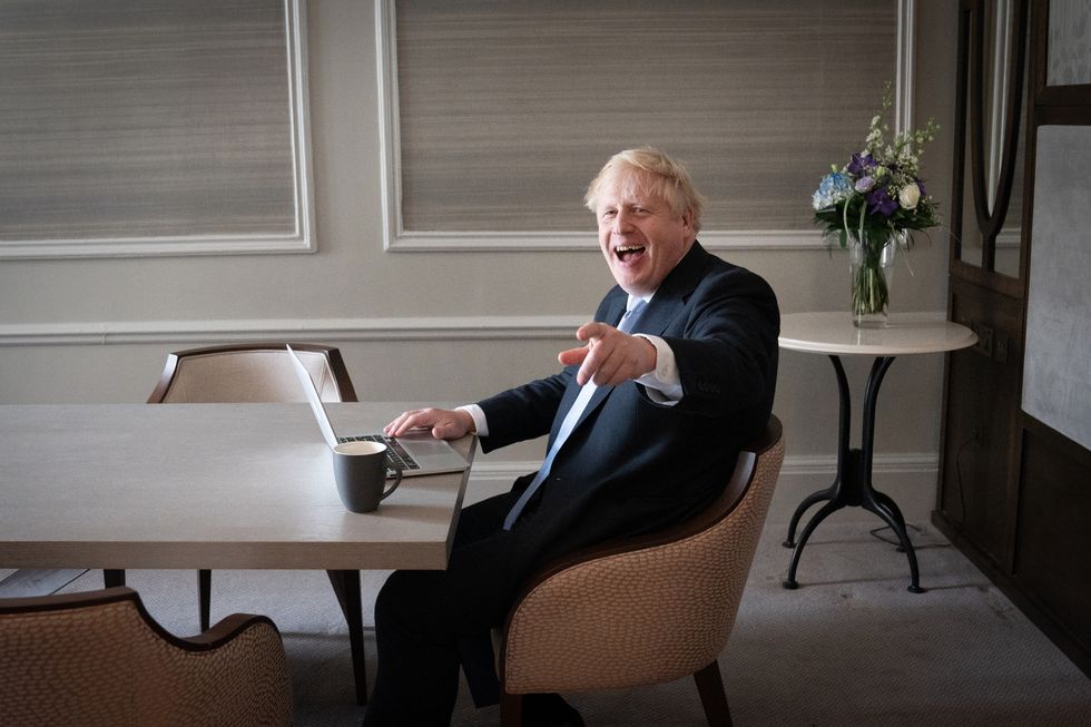 Prime Minister Boris Johnson prepares his keynote speech in his hotel room in Manchester before addressing the Conservative Party Conference on Wednesday. Picture date: Tuesday October 5, 2021.