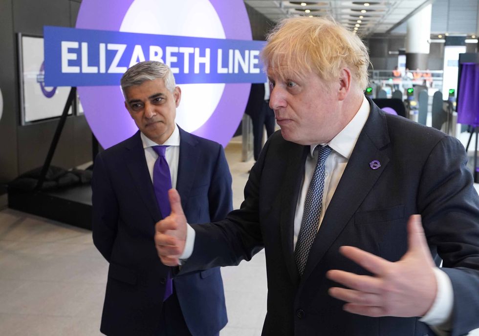 Prime Minister Boris Johnson (right) and Mayor of London Sadiq Khan at Paddington station in London, to mark the completion of London's Crossrail project by travelling on the Elizabeth line