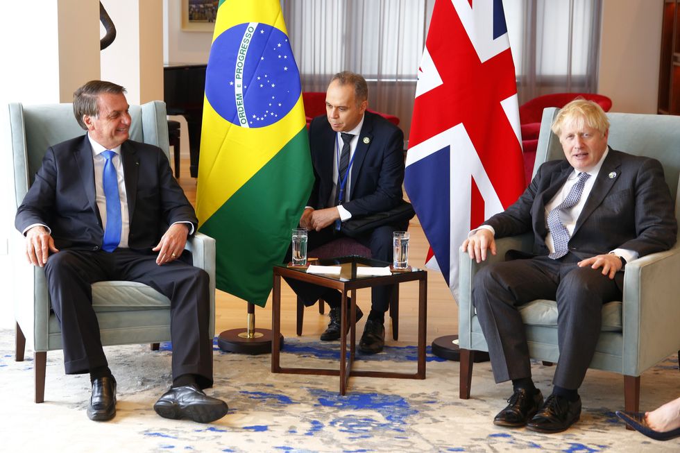 Prime Minister Boris Johnson (right) with Brazil's president Jair Bolsonaro (left) during a bilateral meeting at the UK diplomatic residence in New York.