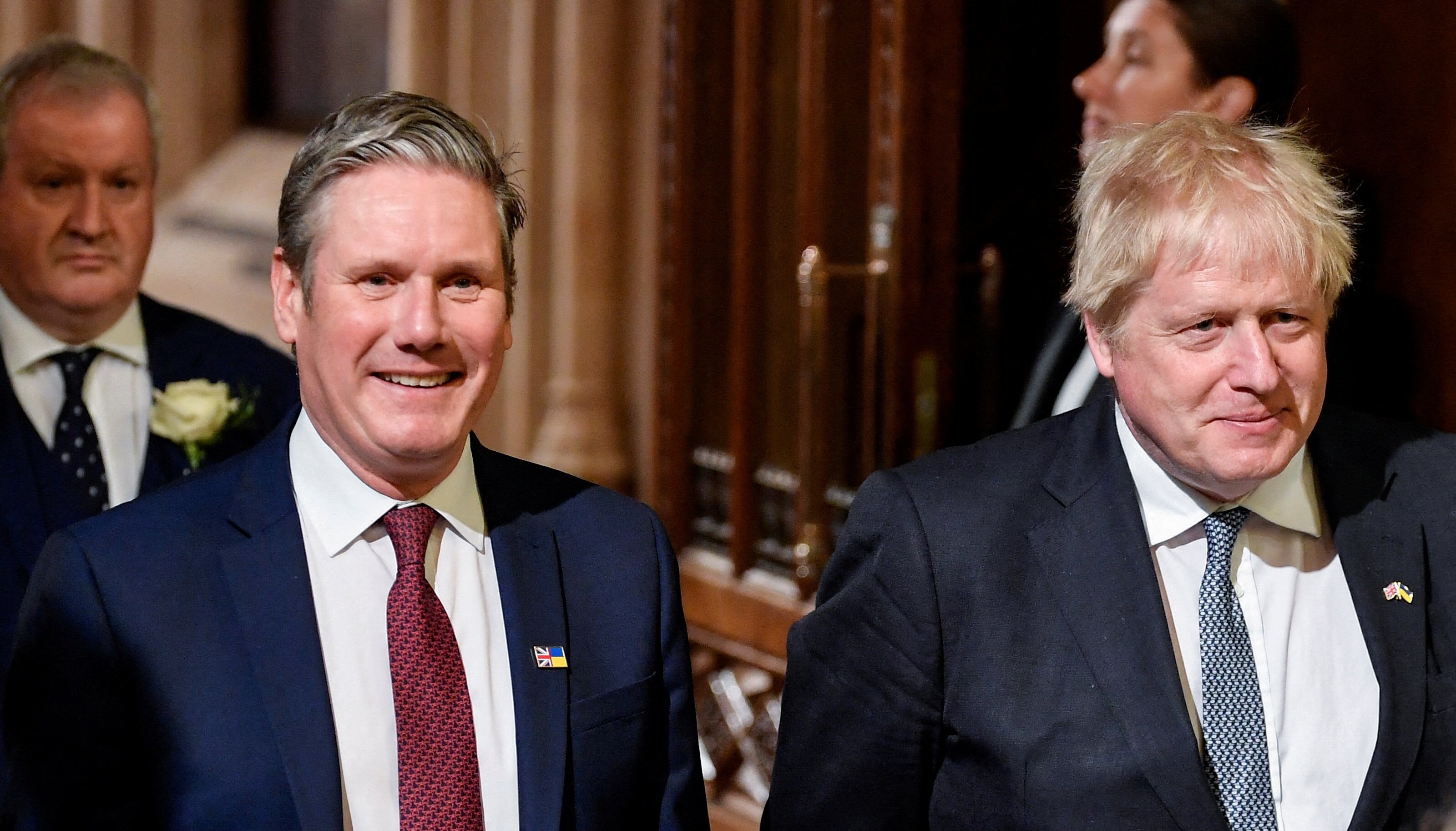 Prime Minister Boris Johnson (right) with the leader of the Labour Party Keir Starmer walk through the Members' Lobby at the Palace of Westminster ahead of the State Opening of Parliament in the House of Lords, London. Picture date: Tuesday May 10, 2022.