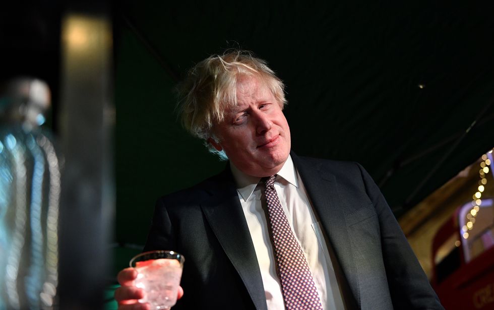 Prime Minister Boris Johnson samples an Isle of Harris Gin as he visits a UK Food and Drinks market which has been set up in Downing Street, London. Picture date: Tuesday November 30, 2021.