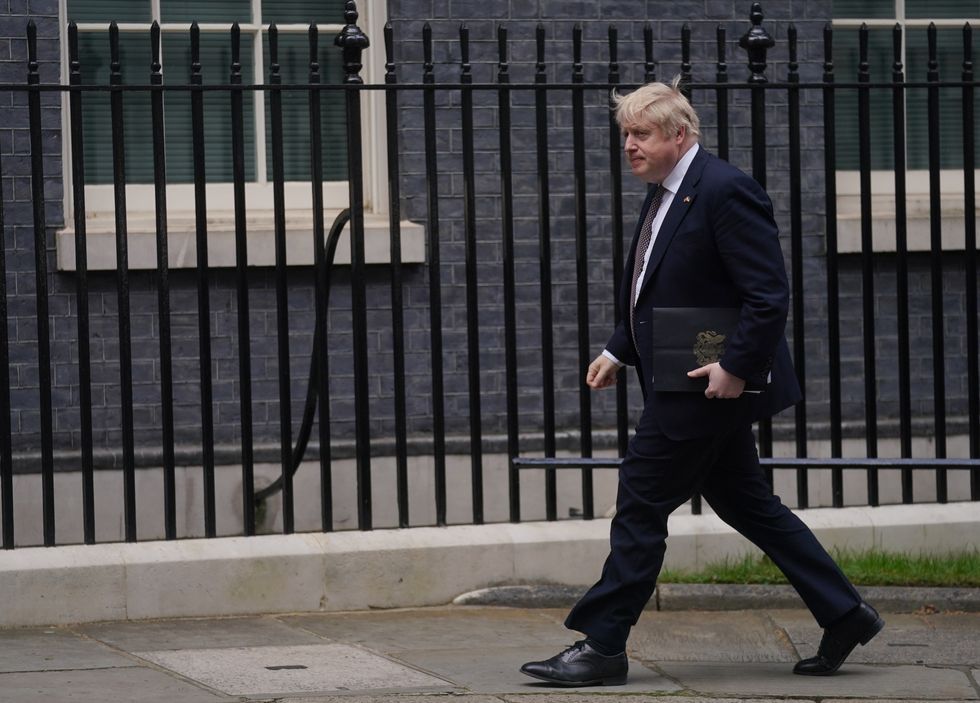 Prime Minister Boris Johnson walks back to 10 Downing Street following a press conference in the Downing Street Briefing Room. Picture date: Friday April 8, 2022.