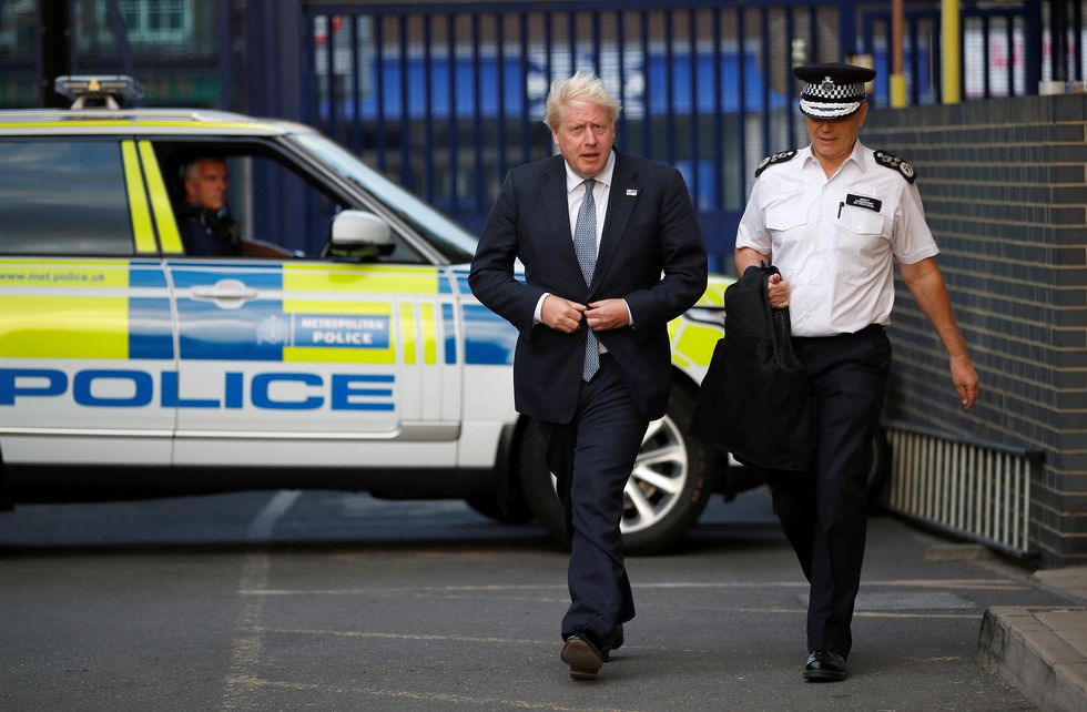 Prime Minister Boris Johnson walks with Stephen House, acting commissioner of the Metropolitan Police service, at a police station in south east London, as he undertakes visits to meet police recruits and speak to officers working in one of the 20 Violence Reduction Units. Picture date: Wednesday August 31, 2022.