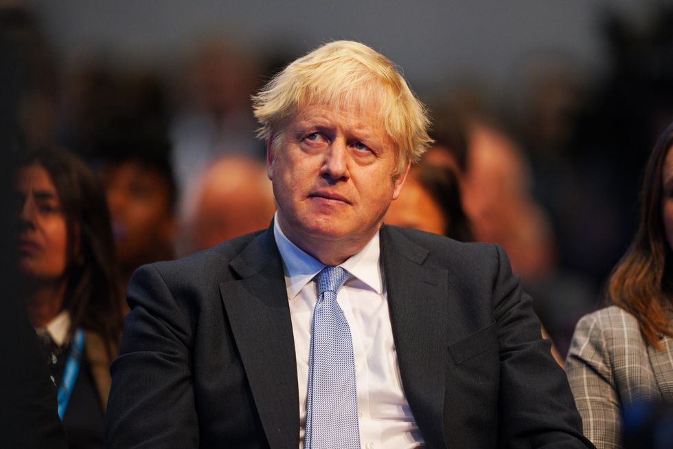 Prime Minister Boris Johnson watches on as Chancellor of the Exchequer Rishi Sunak speaks at the Conservative Party Conference in Manchester. Picture date: Monday October 4, 2021.