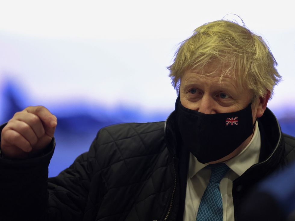 Prime Minister Boris Johnson wears a face mask during a visit to RAF Valley in Anglesey, North Wales. The Prime Minister is set to face further questions over a police investigation into partygate as No 10 braces for the submission of Sue Gray's report into possible lockdown breaches. Picture date: Thursday January 27, 2022.