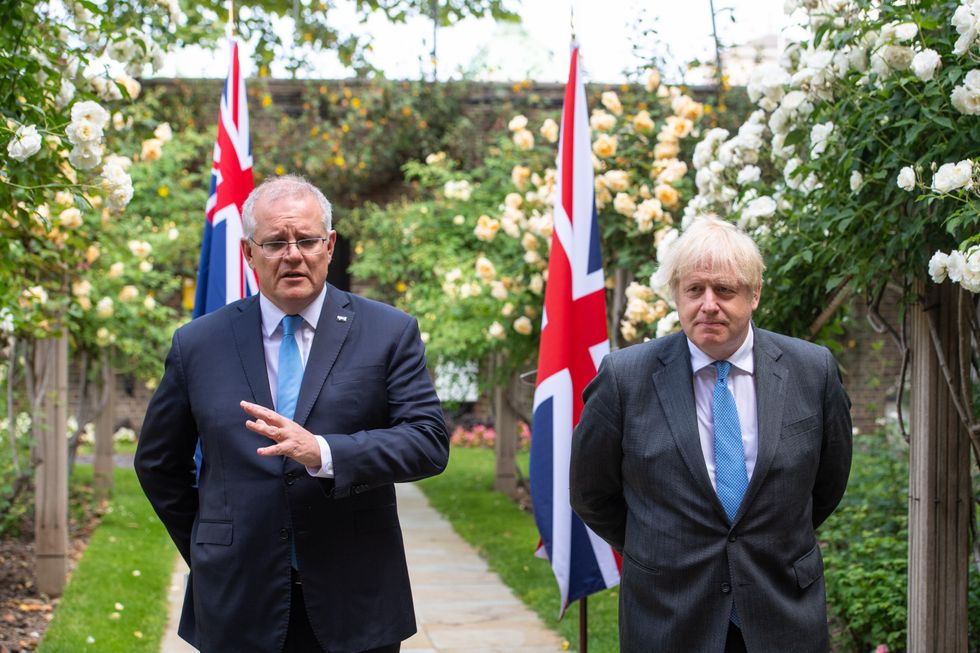 Prime Minister Boris Johnson with Australian Prime Minister Scott Morrison in the garden of 10 Downing Street, London, after agreeing the broad terms of a free trade deal between the UK and Australia, the UK's first trade deal negotiated fully since leaving the European Union. Picture date: Tuesday June 15, 2021.