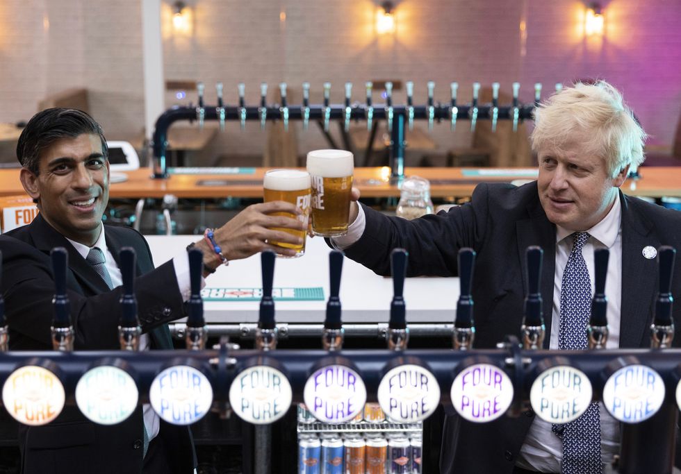 Prime Minister Boris Johnson with Chancellor of the Exchequer Rishi Sunak during a visit to Fourpure Brewery