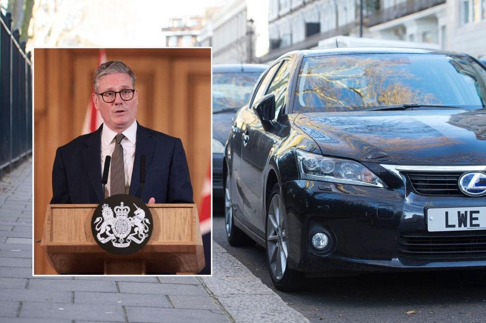 Prime Minister Keir Starmer and a row of parked cars