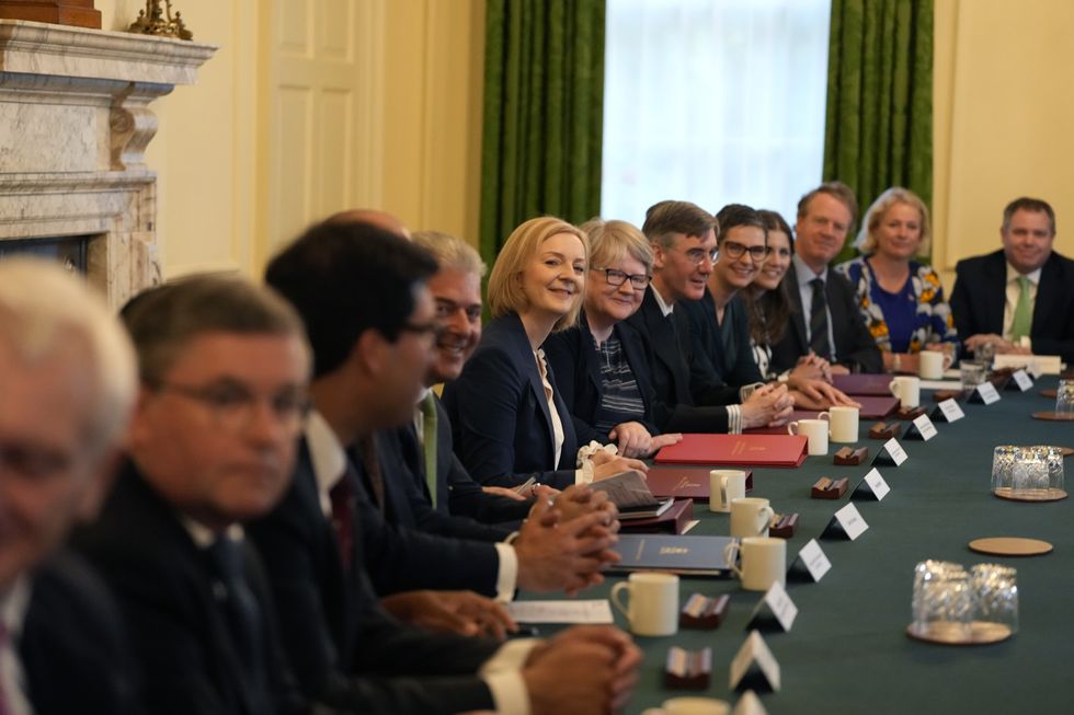 Prime Minister Liz Truss (centre) hosts the first cabinet meeting with (clockwise from left of PM) Justice Secretary Brandon Lewis , Deputy Prime Minister and Health Secretary Therese Coffey, Business Secretary Jacob Rees-Mogg, Work and Pensions Secretary Chloe Smith, Culture Secretary Michelle Donelan, Scottish Secretary Alister Jack, Vicky Ford, development minister in the Foreign Office, her new cabinet in Downing Street in London. Picture date: Wednesday September 7, 2022.