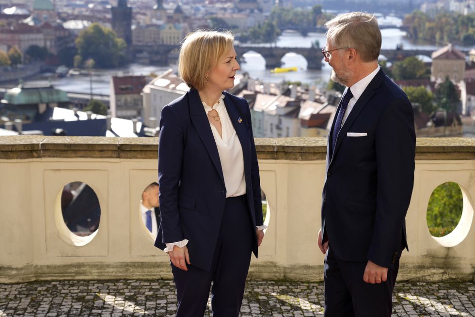 Prime Minister Liz Truss is welcomed by Prime Minister of the Czech Republic Petr Fiala, as she arrives at Kramar's Villa, the official residence of the Prime Minister of the Czech Republic ahead of attending the European Political Community (EPC) summit in Prague on Thursday with other European leaders. Picture date: Thursday October 6, 2022.