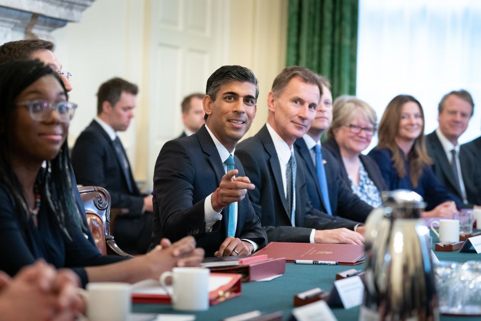 Prime Minister Rishi Sunak (centre), alongside the Chancellor of the Exchequer, Jeremy Hunt (centre right), holds his first Cabinet meeting in Downing Street.