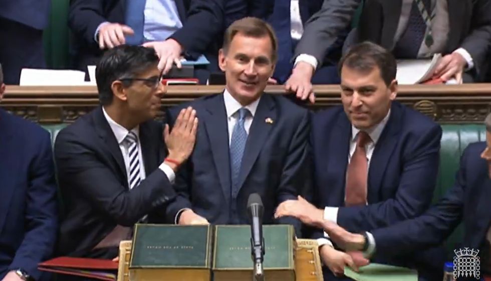 Prime Minister Rishi Sunak congratulates Chancellor of the Exchequer Jeremy Hunt after he delivered his autumn statement to MPs in the House of Commons, London. Picture date: Thursday November 17, 2022.