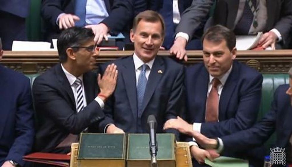 Prime Minister Rishi Sunak congratulates Chancellor of the Exchequer Jeremy Hunt after he delivered his autumn statement to MPs in the House of Commons, London. Picture date: Thursday November 17, 2022.