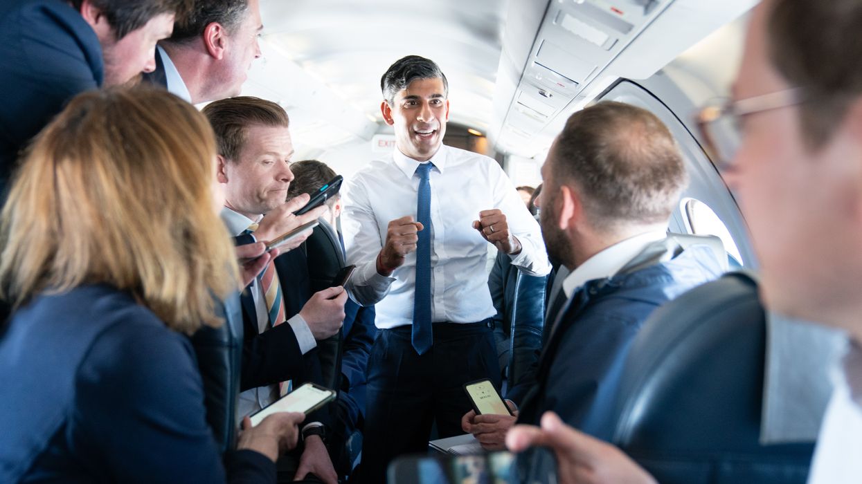 Prime Minister Rishi Sunak talks to journalists on his plane
