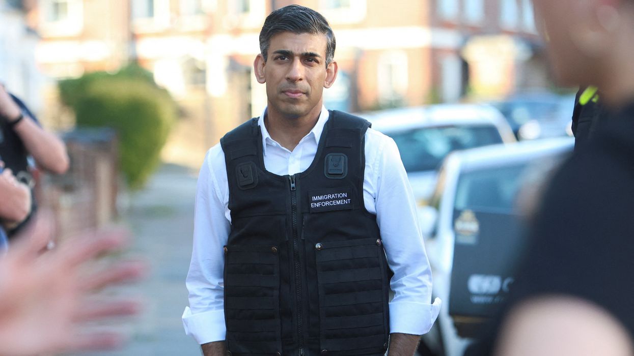 Prime Minister Rishi Sunak watches an immigration raid in north west London