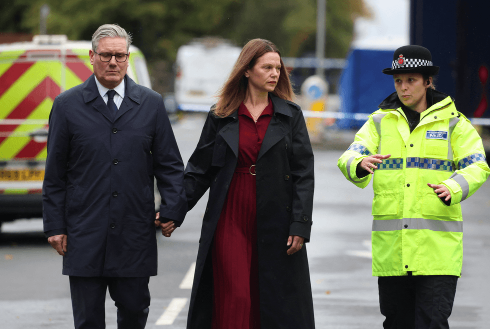 Prime Minister Sir Keir Starmer and wife Victoria visit the scene of the attack near the Heaton Park Hebrew Congregation Synagogue, on October 3, 2025 in Manchester, England.