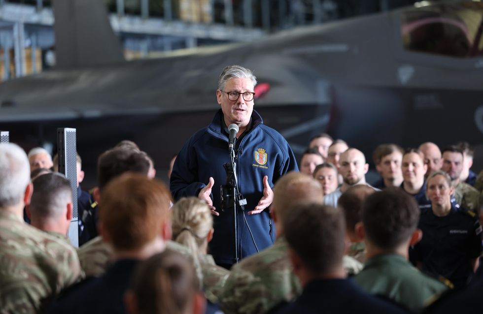 Prime Minister Sir Keir Starmer speaks to the crew of HMS Prince of Wales, the Royal Navy's flagship aircraft carrier, in front of a F35 fighter aircraft in the hangar of the carrier in Plymouth, Devon, ahead of an eight-month deployment to the Indo-Pacific region on Operation Highmast