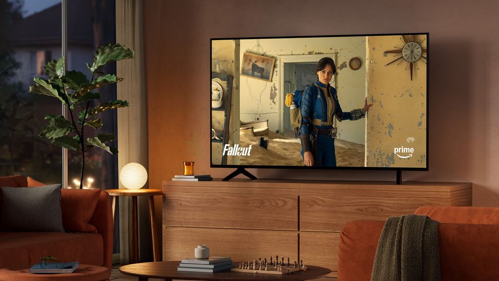prime video series fallout is pictured on-screen in a living room