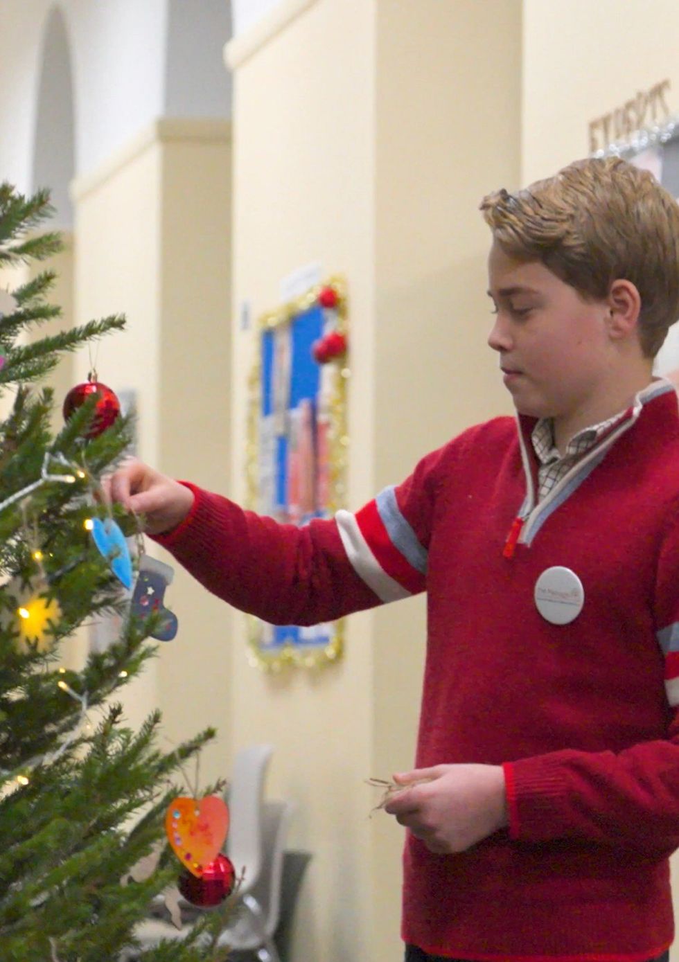 Prince George decorates a Christmas tree