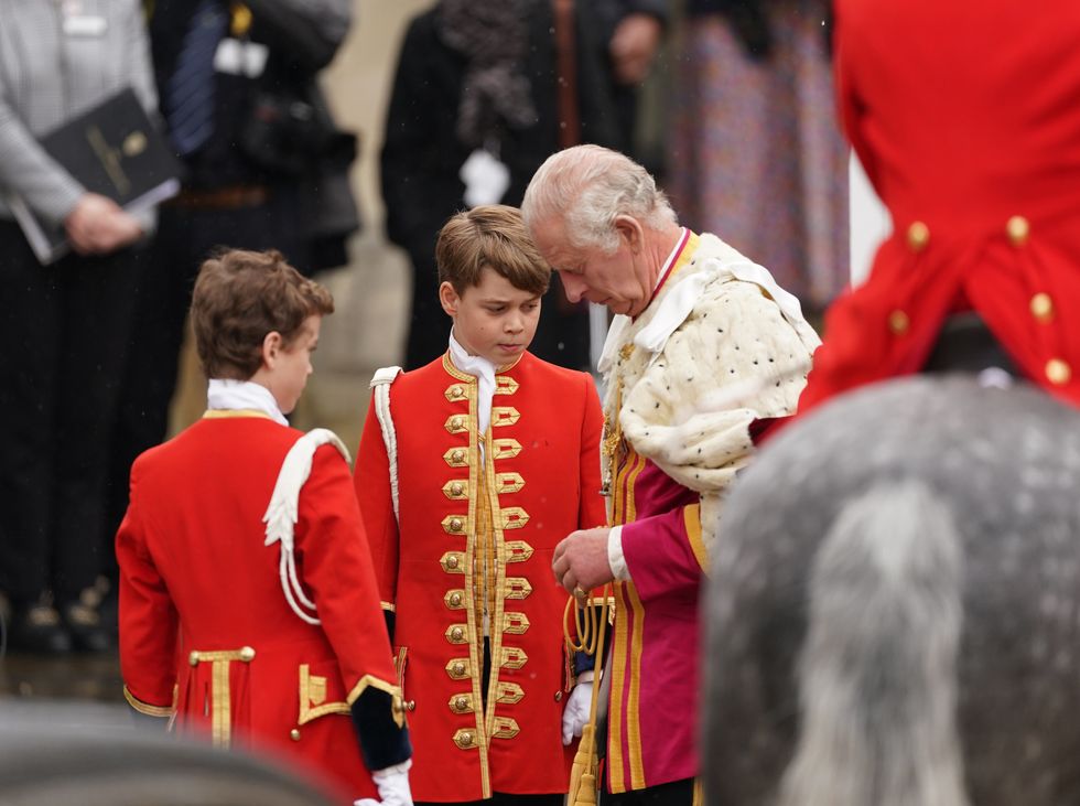 Prince George with his grandfather King Charles at the Coronation service