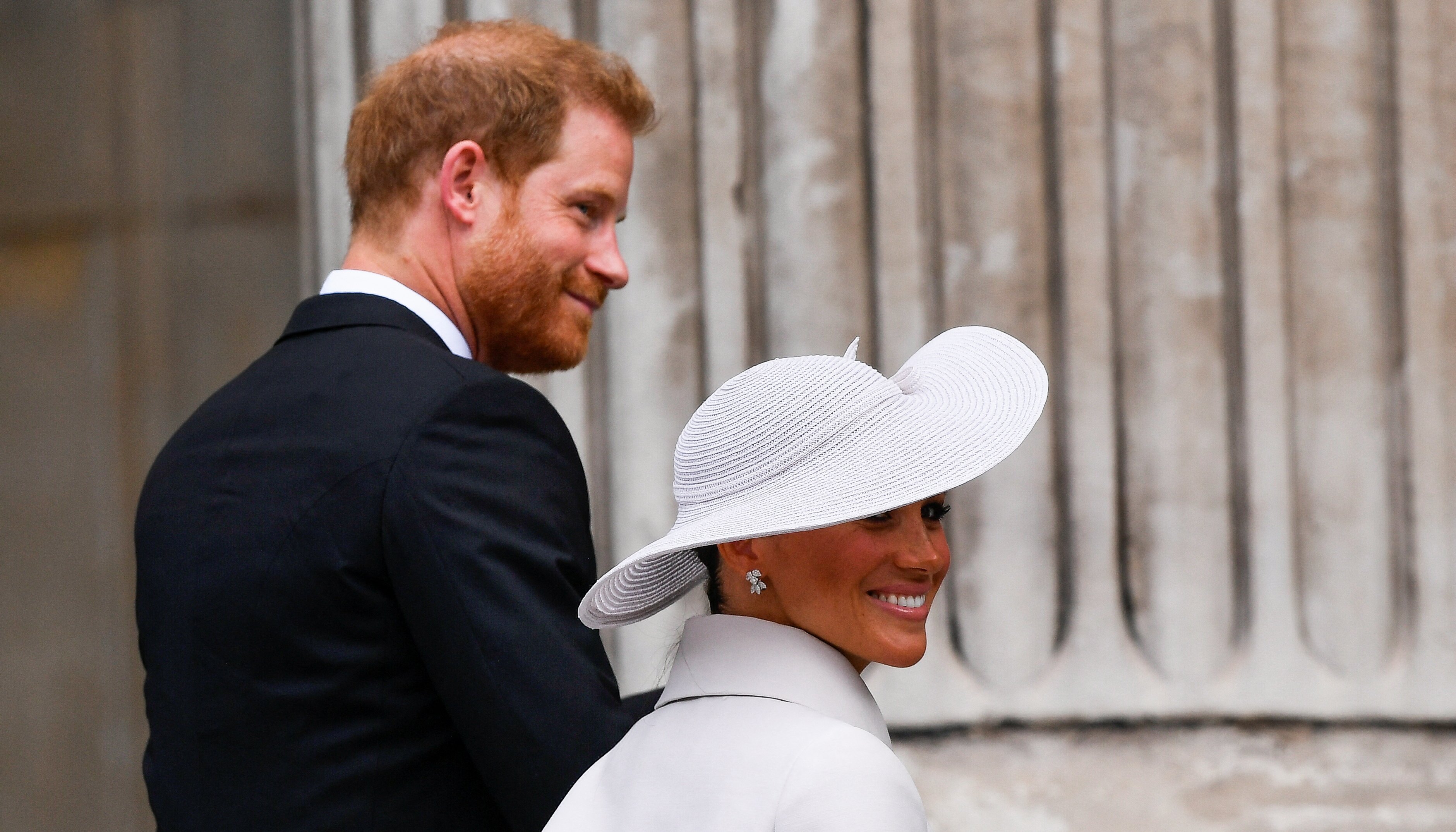 Prince Harry and Meghan ascend the steps of St Paul's holding hands