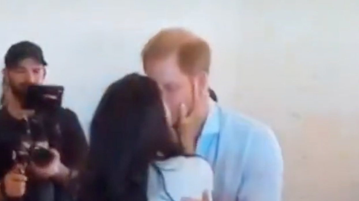 Prince Harry and Meghan Markle kissing