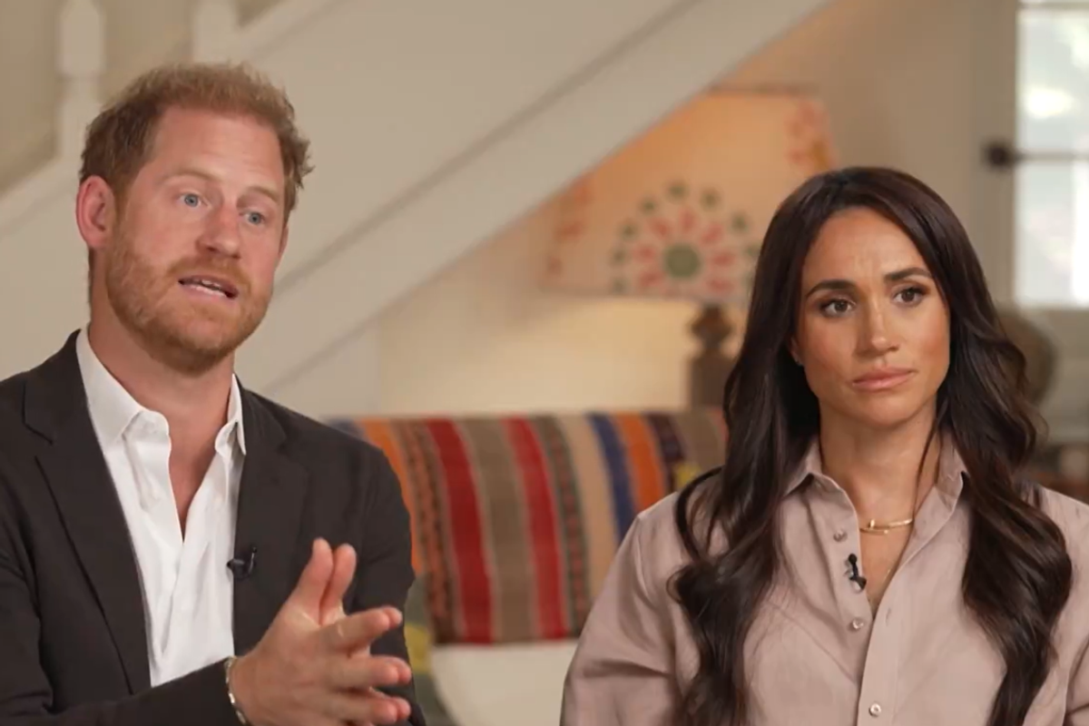 Prince Harry seems 'disengaged' as he 'gazes off into the distance' while Meghan Markle speaks in new interview