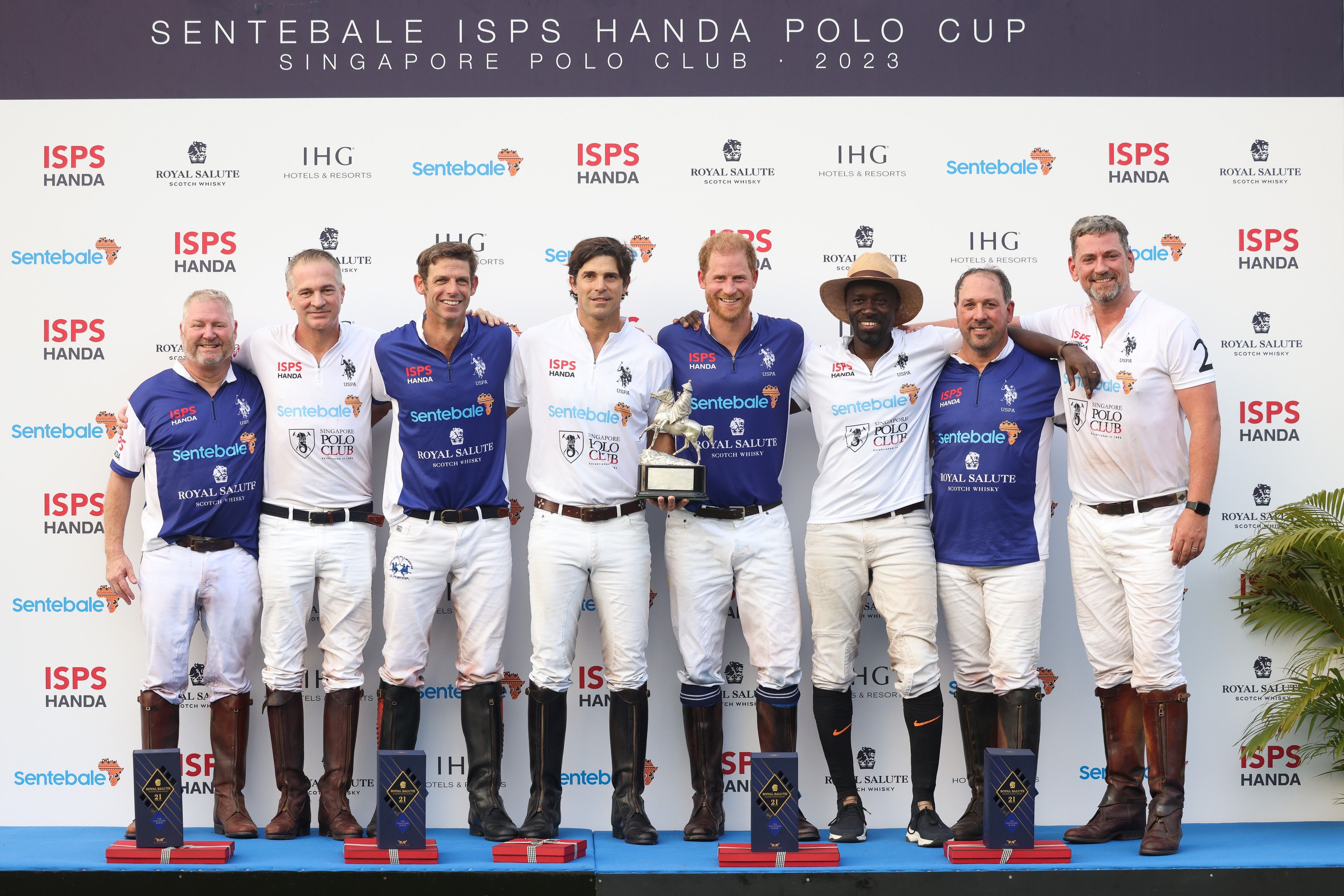 Prince Harry and players of the Royal Salute Sentebale and Singapore Polo Club