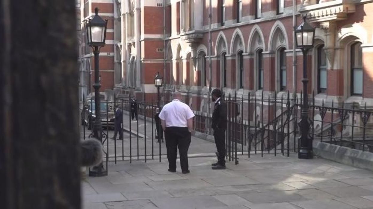 Prince Harry rushed out of courtroom by his bodyguards as security forced to evict woman shouting at duke