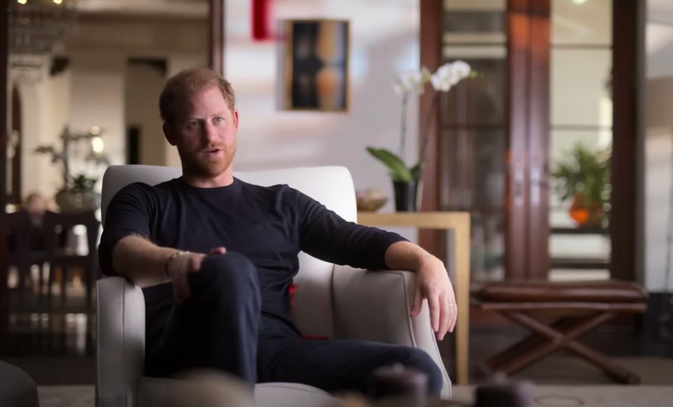 Prince Harry says the royal family were 'surprised that a ginger could land such a beautiful woman and such an intelligent woman'.