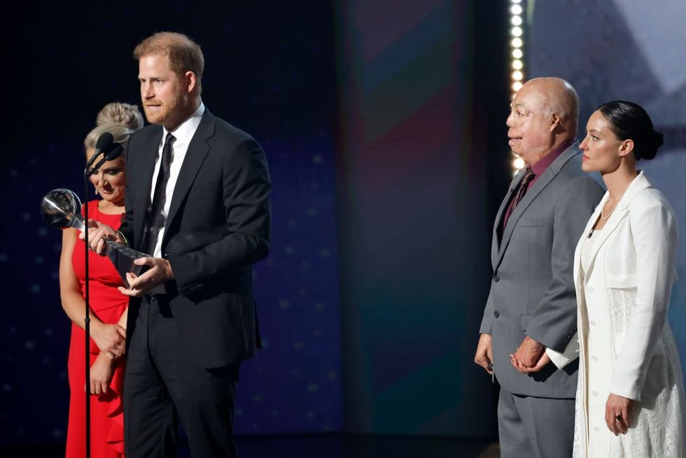 Prince Harry speaking into a microphone