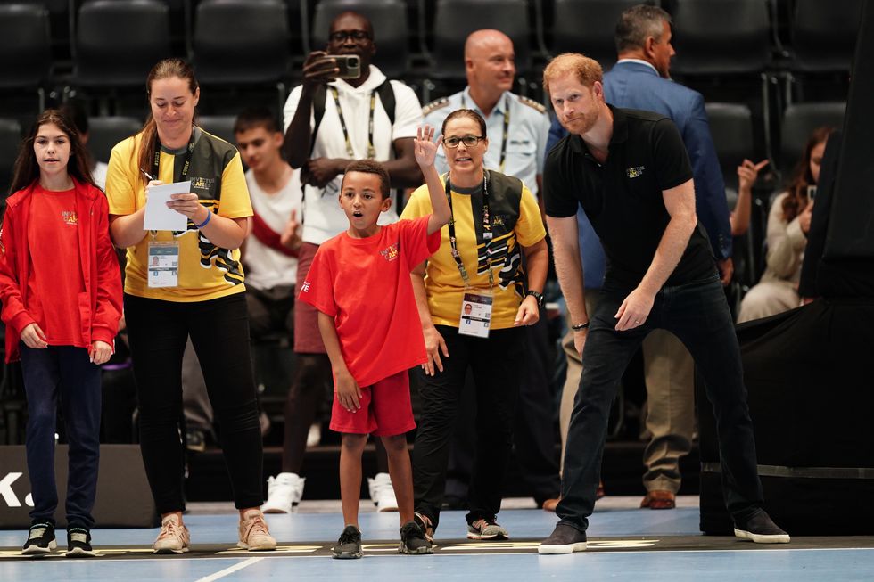 Prince Harry standing courtside in Dusseldorf