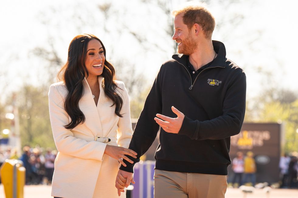Prince Harry walking with Meghan Markle