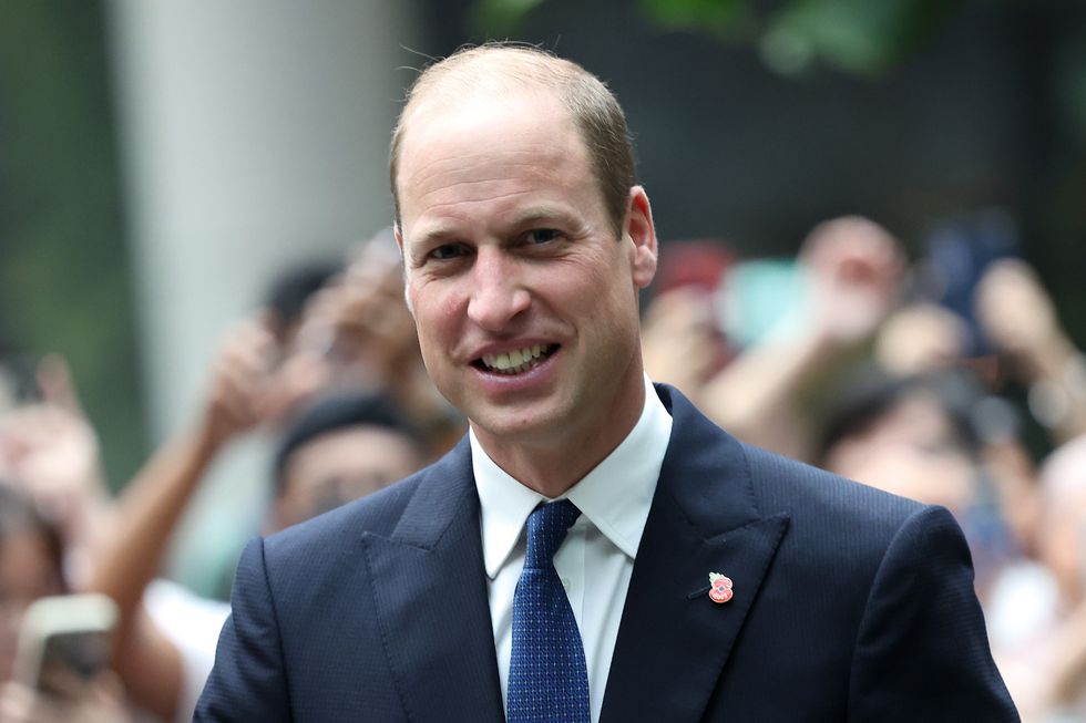Prince of Wales greets members of the public during his visit to Jewel Changi Airport