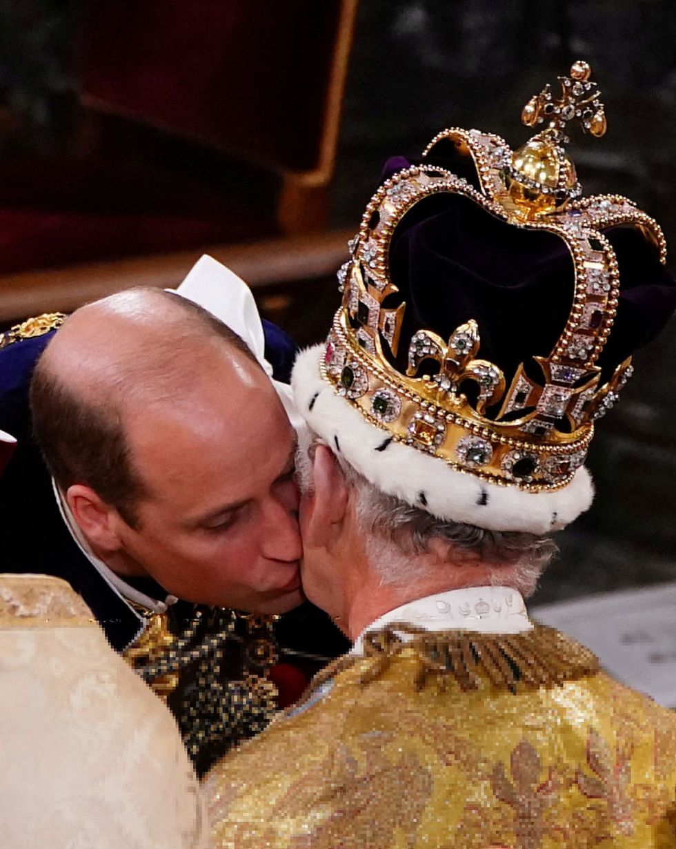 Prince of Wales kisses his father at the Coronation ceremony