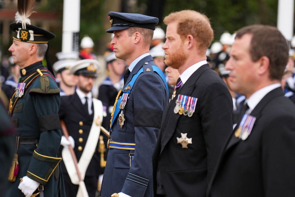 Prince William and Prince Harry follow a gun carriage carrying the coffin of Queen Elizabeth II