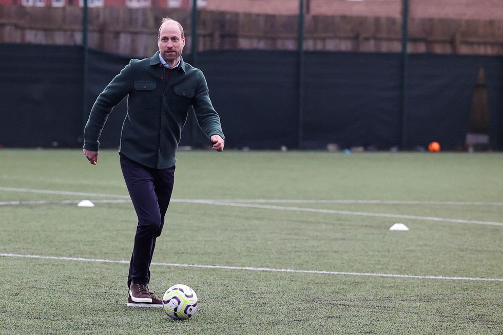 Prince William playing football