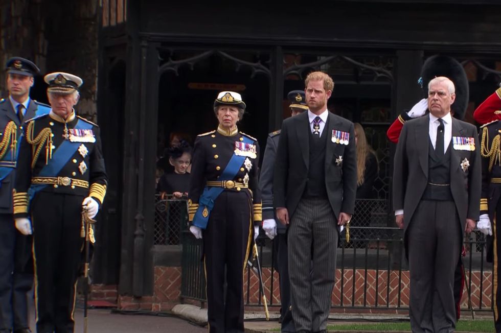 Prince William, Princess Anne, Prince Harry and Prince Andrew stand as Queen Elizabeth II's coffin is taken into the chapel