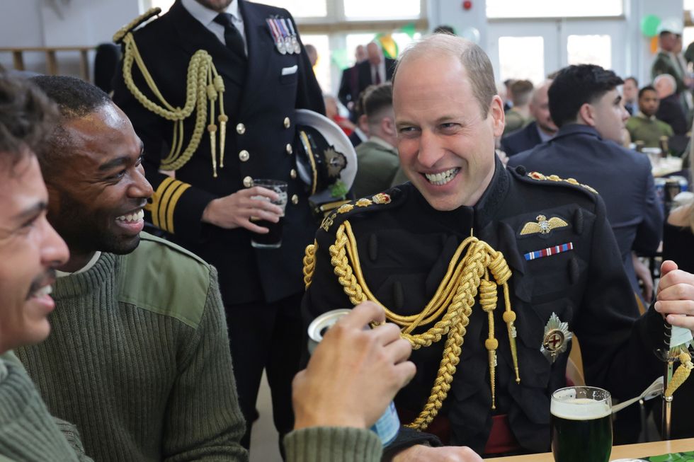 Prince William sat in his Army uniform with troops