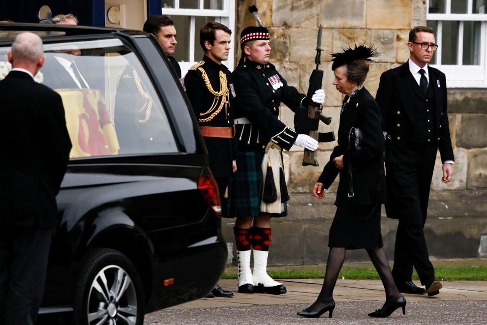 Princess Anne approaches the hearse carrying Queen Elizabeth II's coffin.