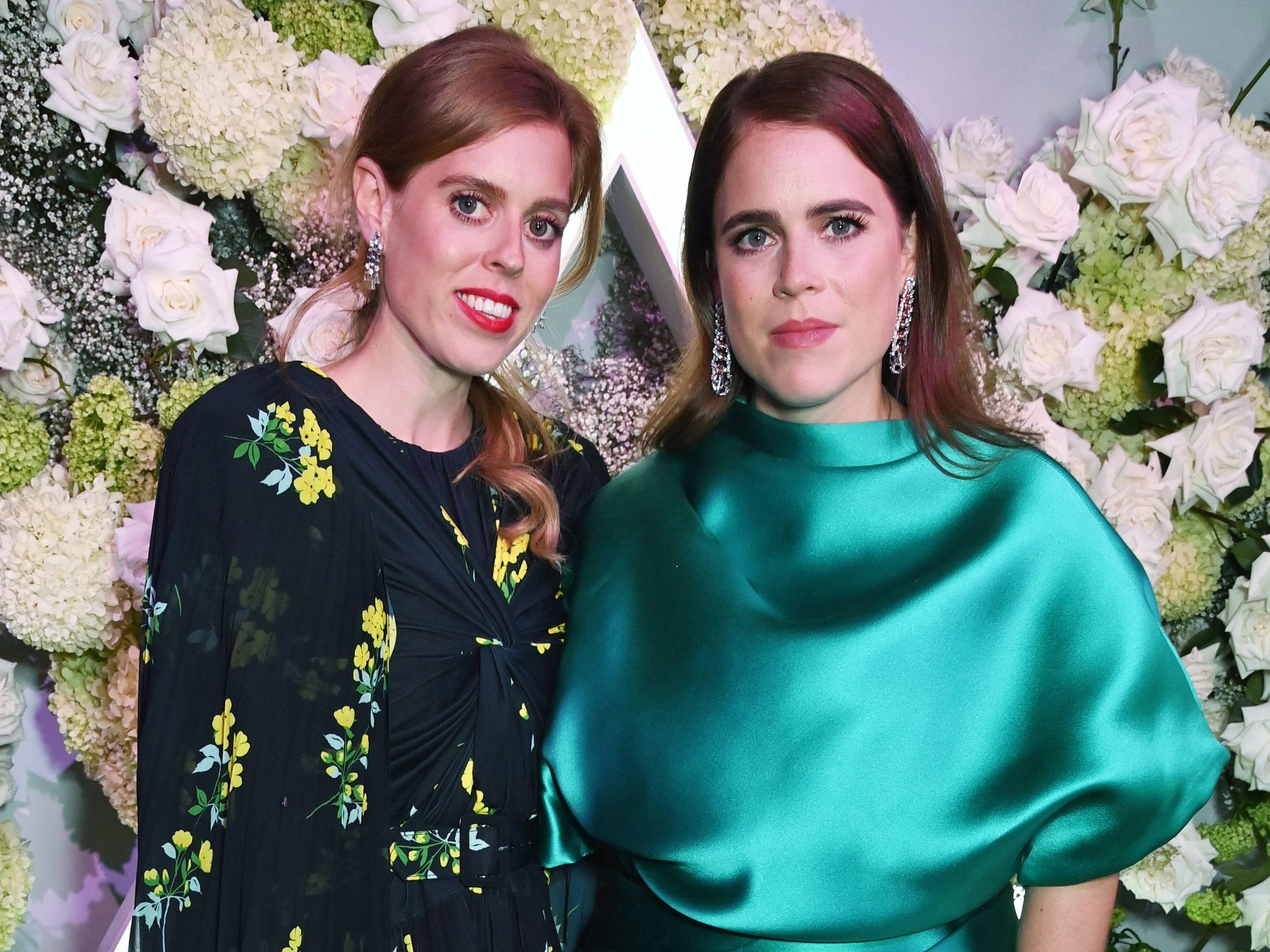 Princess Beatrice and Princess Eugenie pose for a photo