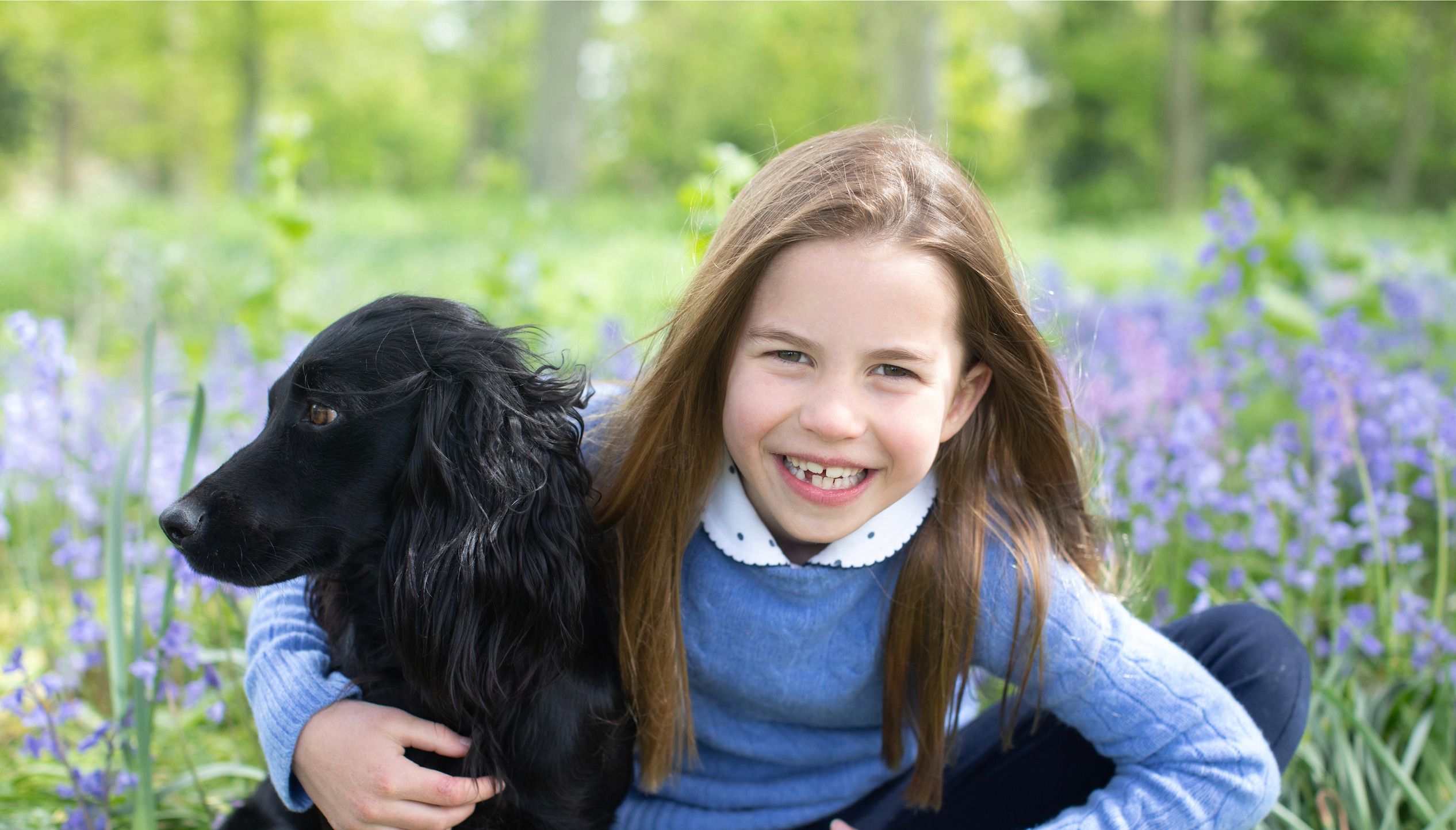 Princess Charlotte is photographed with her dog, Orla.