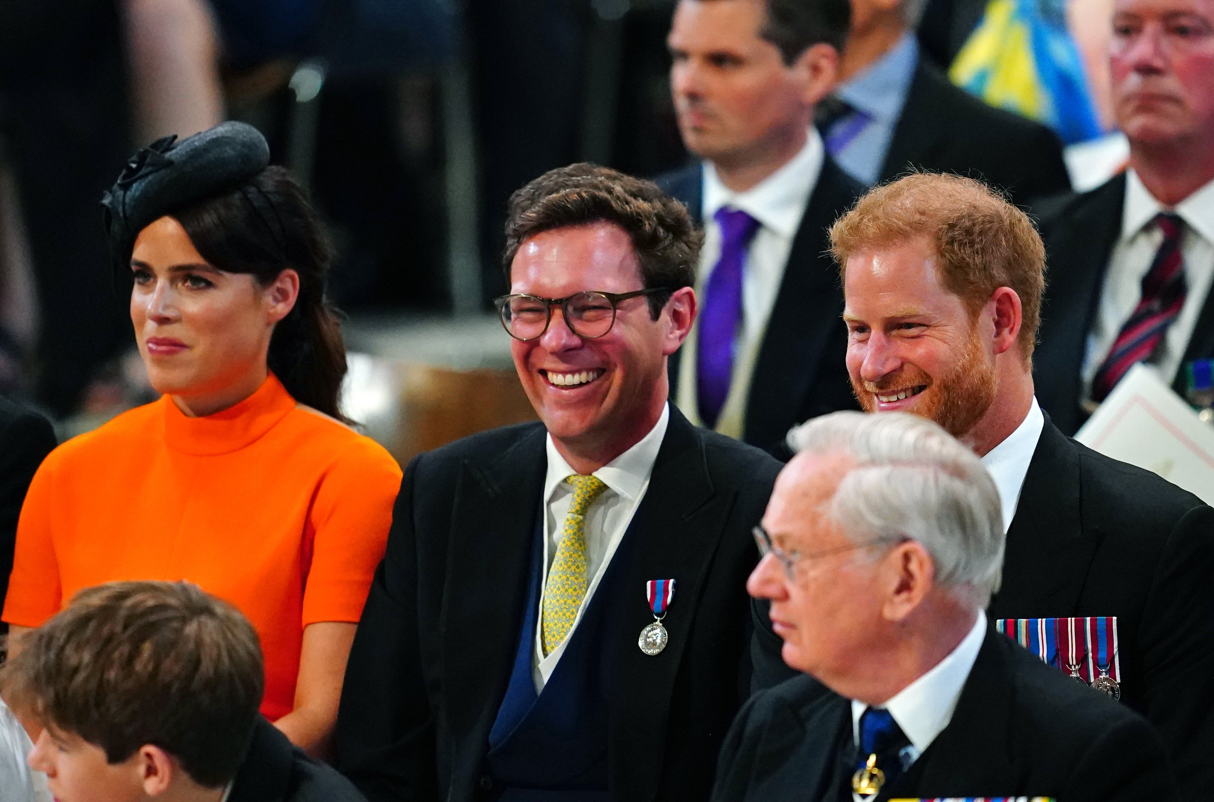 Princess Eugenie and husband Jack Brooksbank laugh with the Duke of Sussex prior to the National Service of Thanksgiving at St Paul's Cathedral