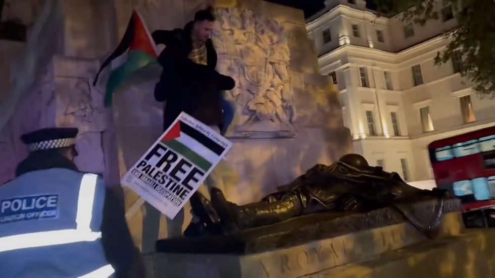 Pro-Palestine protesters scale a war memorial