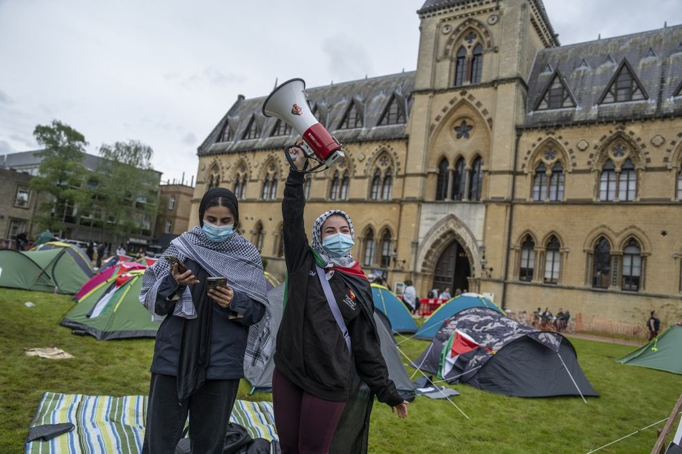 Pro-Palestine student activists take part in an encampment in front of the Oxford University Museum of Natural History