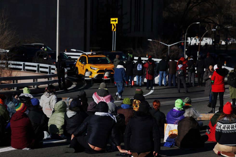 Pro-Palestinian demonstrators block a Brooklyn Bridge roadway