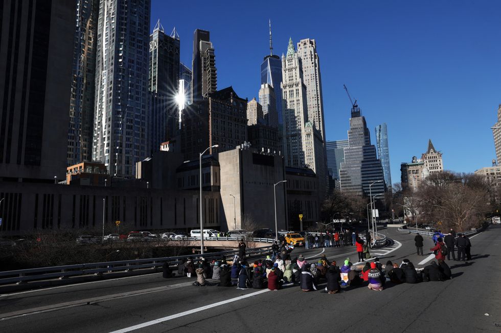 Pro-Palestinian demonstrators block a Brooklyn Bridge roadway