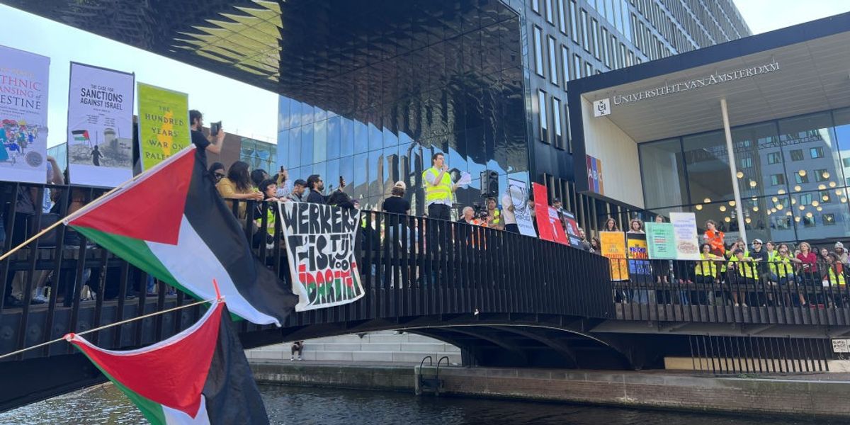 NextImg:Amsterdam pro-Palestine protesters clash with police as officers armed with batons move in