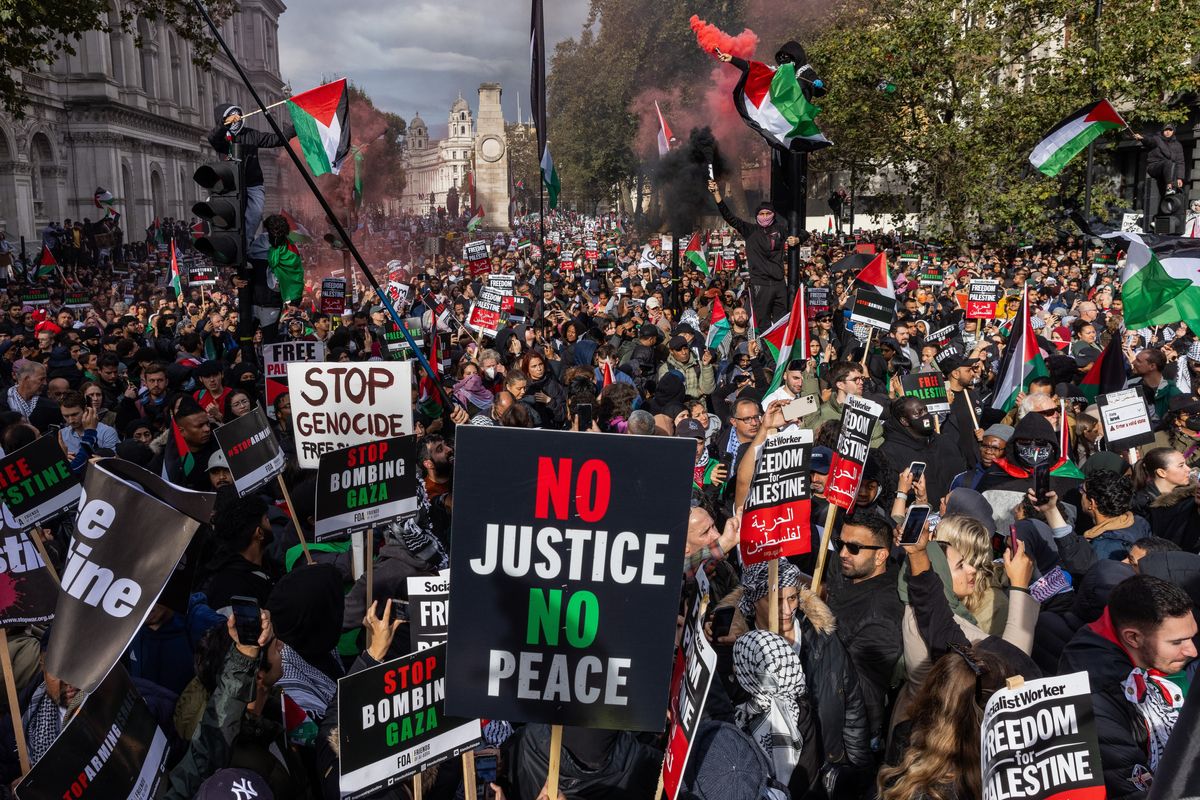 Pro-Palestinian protesters attend a rally close to Downing Street in support of the Palestinian population of Gaza