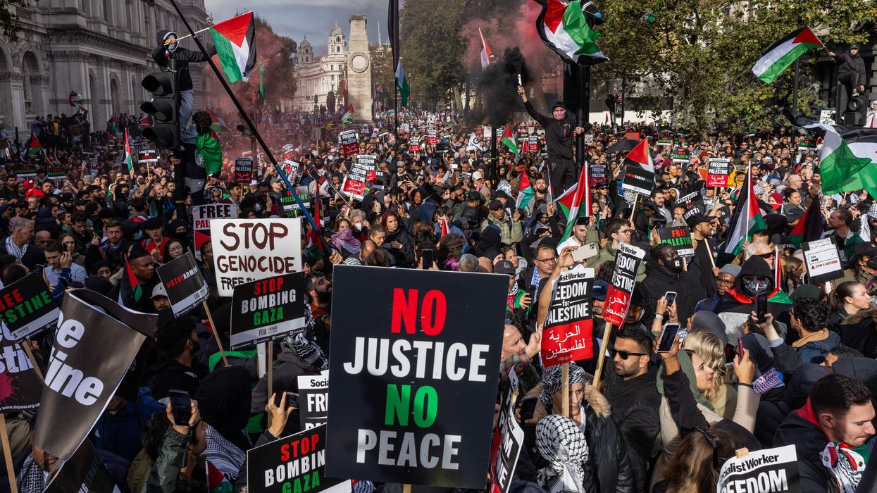 Pro-Palestinian protesters attend a rally close to Downing Street in support of the Palestinian population of Gaza